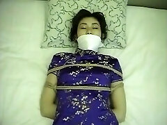 Chinese dress dame tied up and gagged