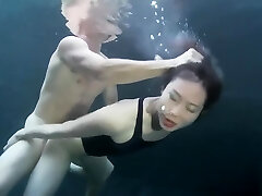 swimsuit girl hookup with a guy underwater