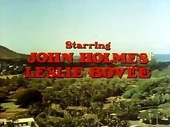 Classic porn with John Holmes getting his enormous cock deep throated