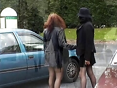 Two babes flashing their tits and slit in public place