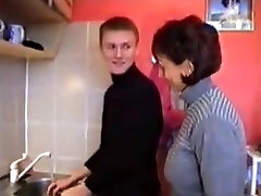 Russian mother Amalia with her boy in kitchen Russian mother Amalia with her boy in kitchen