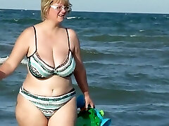 chubby mom stagged on the beach