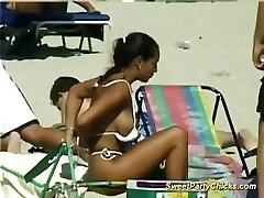 Mouth-watering party chicks flashing their big tits on the beach