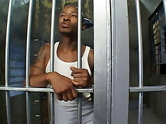 Horny police woman deep-throats the prisoner's dick in his cage