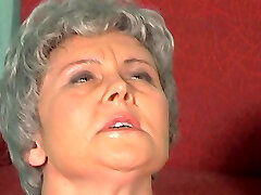Granny rolls her eyes because a big cock is stuck in her culo