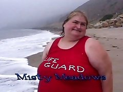 Fat lifeguard bi-otches munch food on the beach