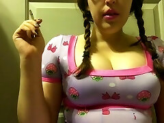 Chubby Brunette Teen with Big Natural Breasts Smoking in Pigtails