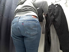 In a fitting bedroom in a public store, the camera caught a chubby milf with a gorgeous ass in see-through panties. Phat Ass White Girl.