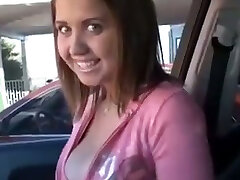 Glad young babe in the car flashes her gorgeous tits