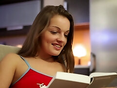 Sexy babe on a chair in the kitchen fingering her jiggly cunt