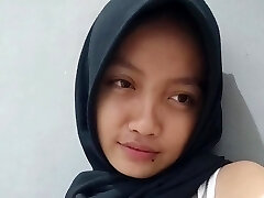 A hot slut in a hijab records a bang-out flick for her boyfriend where she masturbates