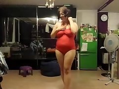 Giant chick does a strip tease