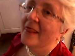 Granny with xxl boobs disrobing and spreading