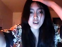 asian showing off her assets on web cam