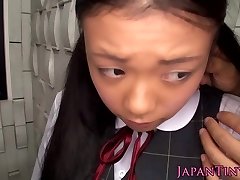 Innocent asian schoolgirl tasting spunk closeup