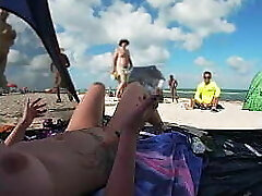Exhibitionist Wifey 511 - Mrs Smooch gives us her NUDE BEACH POV view of a VOYEUR Fapping OFF in front of her and several other men witnessing!