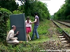 A guy jerks off while observing a couple fucking outdoors