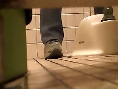 Pissing in the toilet and showing bushy fuckbox on spy webcam
