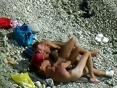 Sexy nymph and two horny dudes enjoy foreplay on the beach when I spy them