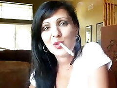 stunning brunette dangles her cigarette
