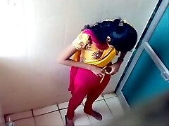 Some inexperienced Indian brunette dolls peeing in the toilet on voyeur cam