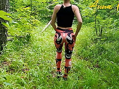 Public masturbation, a woman in leggings walks in nature
