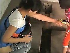 Chinese girls in an old public toilet