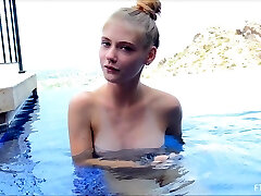 Blonde model Hannah takes a naked swim and posses afterwards