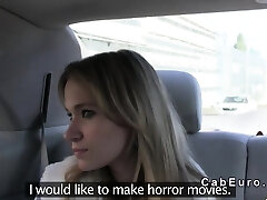 Czech blonde bangs on spandex hood of fake taxi in woods