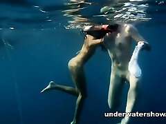 Nastya and Masha are swimming bare in the sea