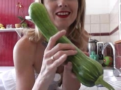 naomi1 in a kitchen with a vegetable