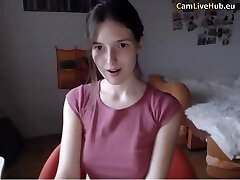 Horny black-haired teen masturbating with a toy