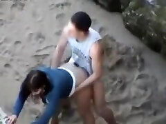 Nubiles rear end style on the beach Nubiles rear end style on the beach