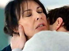 Elderly woman kissing young man 1