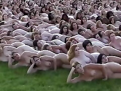 5000 naked people laying out for the camerist who makes books