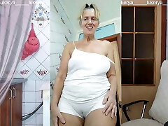 Lukerya in the kitchen in raw white panties, bottom view
