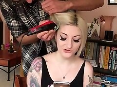 light-haired with tatoos shaves her head