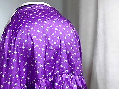 Mature Sally in brief lilac skirt, showing off her assets