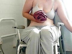 Paraplegic brunette Purplewheelz British milf peeing in the douche