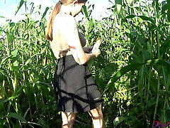 Kate Wood plays with her puss in a cornfield Kate Wood plays with her puss in a cornfield