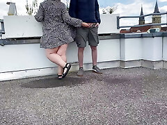 Gorgeous pissing mommy-in-law helps son-in-law piss on the top of the parking lot