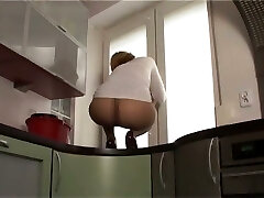 This slut likes to demonstrate off her nylon covered donk on top of the kitchen counter