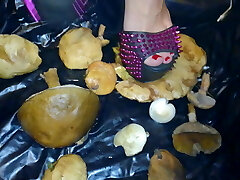 Lady L crush  mushrooms with extreme gaga high heels.