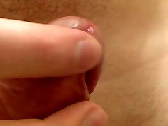 Close up shaved uncut shaft playing with foreskin frenulum