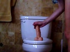 Soccer Mom with big boobs rail a Dildo on Toilet