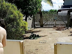 Bare housewife cleaning the balcony Bare housewife cleaning the balcony