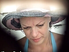 Mature white lady in blue bikini pisses in the public restroom apartment on the beach