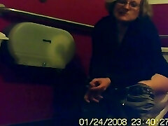 Mature unaware female sitting on a toilet