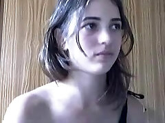 Young coquette with small globes danced in front of the webcam