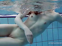 White swimsuit with tattoos babe Roxalana Cheh underwater